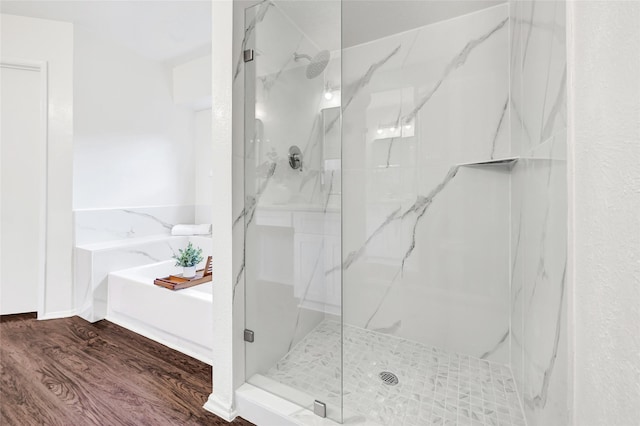 5518 Fair Forest Dr, Houston, TX 77088 - bathroom featuring a marble finish shower, wood finished floors, and a bath