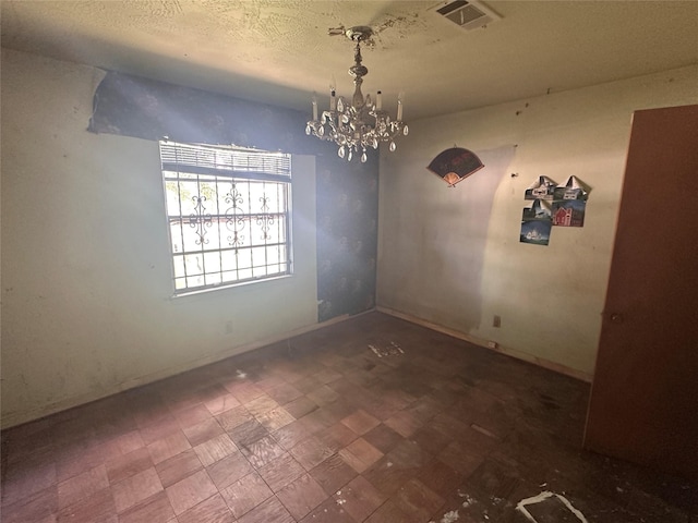 7706 Claiborne St, Houston, TX 77016 - unfurnished room featuring a chandelier and a textured ceiling