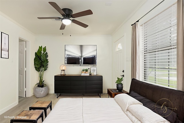 113 N Holmes St, La Porte, TX 77571 - bedroom featuring wood finished floors, ornamental molding, and ceiling fan