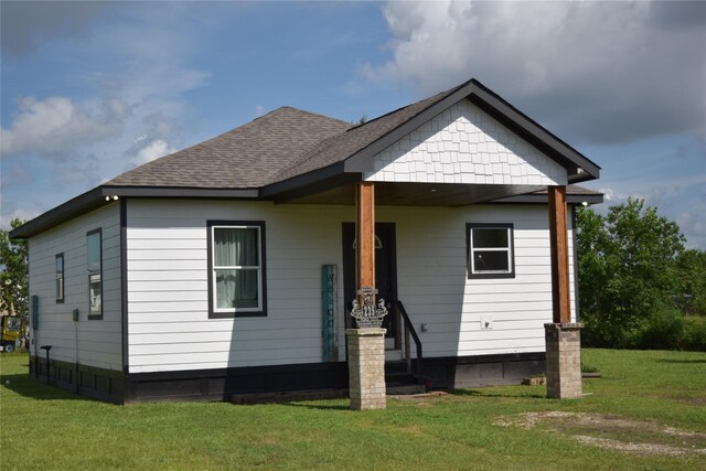 235 Rd 5253, Cleveland, TX 77327 - bungalow-style home featuring a front lawn and roof with shingles