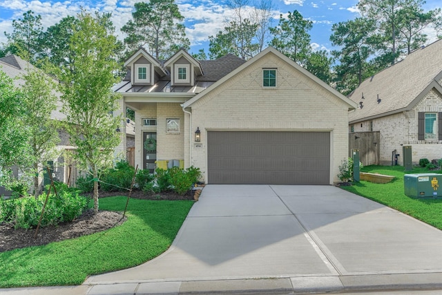 454 Glacier Pass, Montgomery, TX 77316 - view of front of property featuring brick siding, driveway, an attached garage, and a front yard