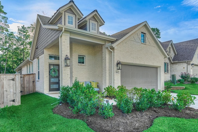 454 Glacier Pass, Montgomery, TX 77316 - view of front of property with brick siding, a garage, and roof with shingles