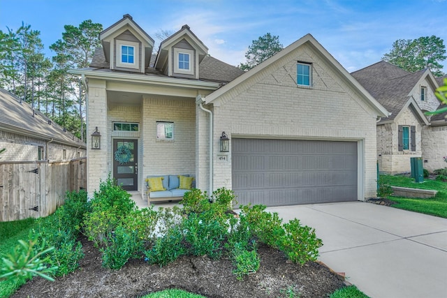 454 Glacier Pass, Montgomery, TX 77316 - view of front of house featuring a garage, brick siding, concrete driveway, and roof with shingles