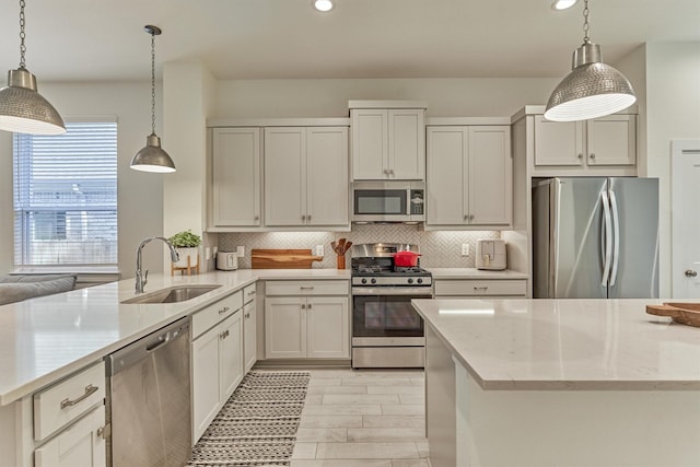 454 Glacier Pass, Montgomery, TX 77316 - kitchen featuring appliances with stainless steel finishes, recessed lighting, decorative backsplash, a peninsula, and light stone countertops