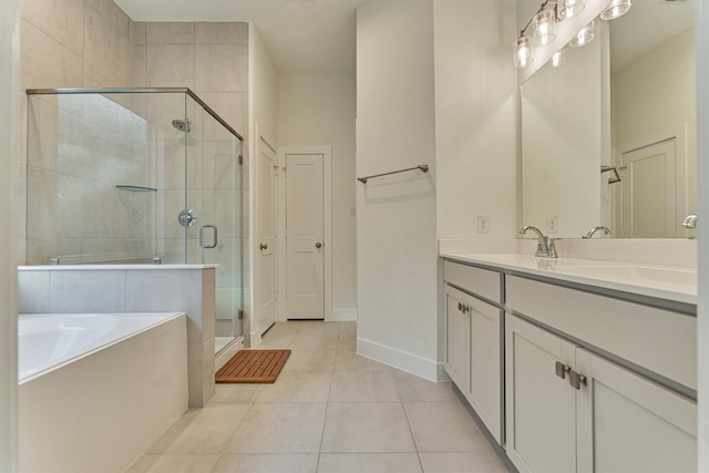 454 Glacier Pass, Montgomery, TX 77316 - bathroom featuring a bath, a shower stall, double vanity, and tile patterned floors
