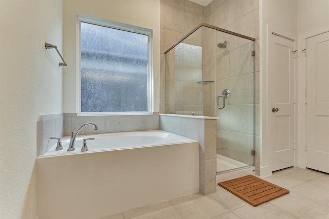 454 Glacier Pass, Montgomery, TX 77316 - full bath featuring a garden tub, a shower stall, and tile patterned flooring