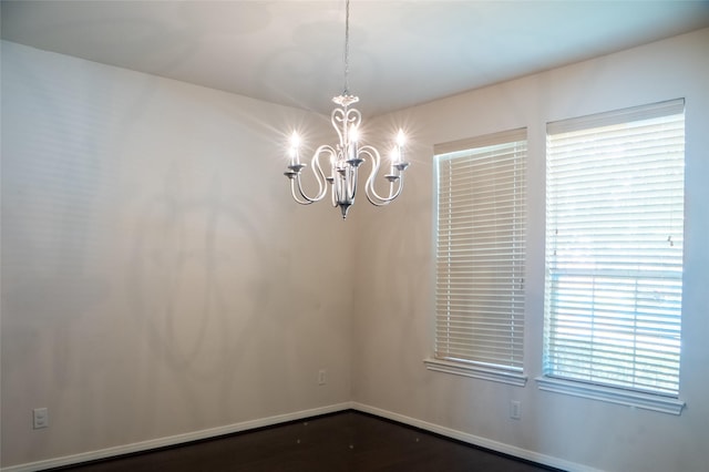 8855 Distant Woods Dr, Houston, TX 77095 - empty room featuring a chandelier and baseboards