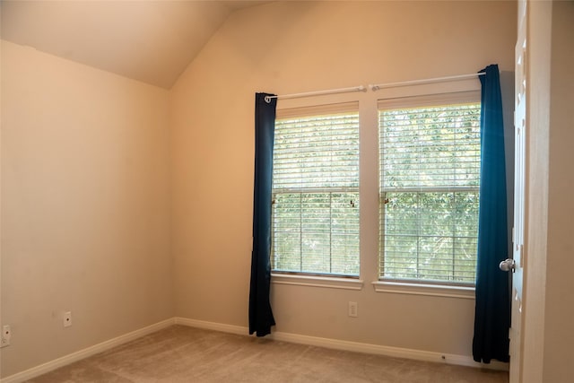 8855 Distant Woods Dr, Houston, TX 77095 - empty room with light carpet and vaulted ceiling