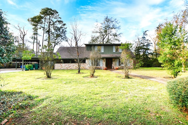 2019 N Thompson St, Conroe, TX 77301 - traditional home featuring a front lawn and stone siding