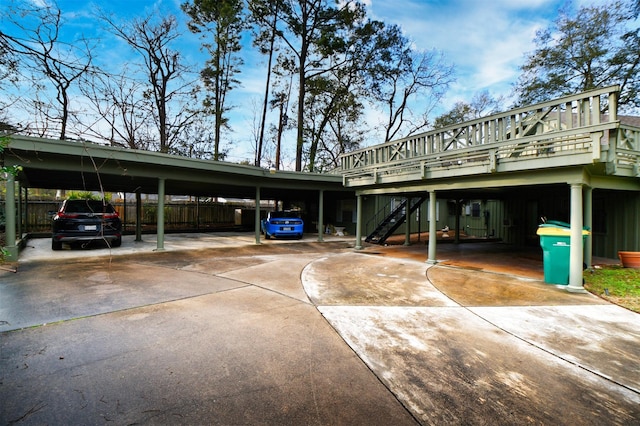 2019 N Thompson St, Conroe, TX 77301 - view of parking / parking lot with driveway, stairway, and an attached carport