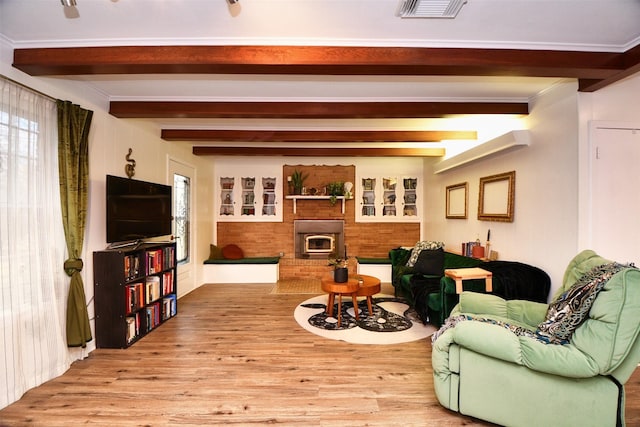 2019 N Thompson St, Conroe, TX 77301 - living room with wood finished floors and beam ceiling
