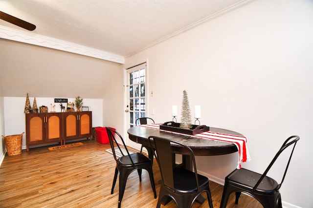 2019 N Thompson St, Conroe, TX 77301 - dining space featuring light wood-type flooring, crown molding, lofted ceiling, and ceiling fan