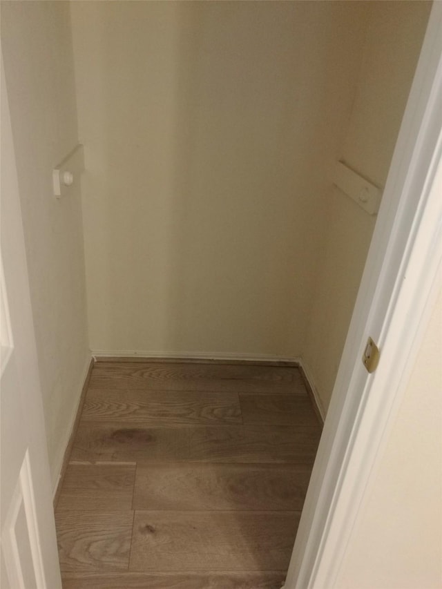 16623 Newglen Ln, Houston, TX 77084 - walk in closet featuring wood finished floors