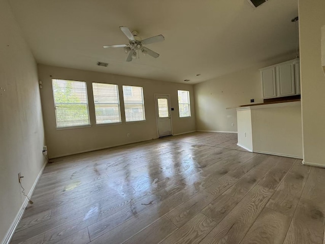 16623 Newglen Ln, Houston, TX 77084 - unfurnished living room featuring a ceiling fan and wood finished floors