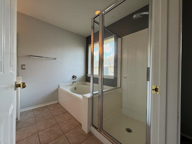 16623 Newglen Ln, Houston, TX 77084 - bathroom featuring a garden tub, a shower stall, and tile patterned floors
