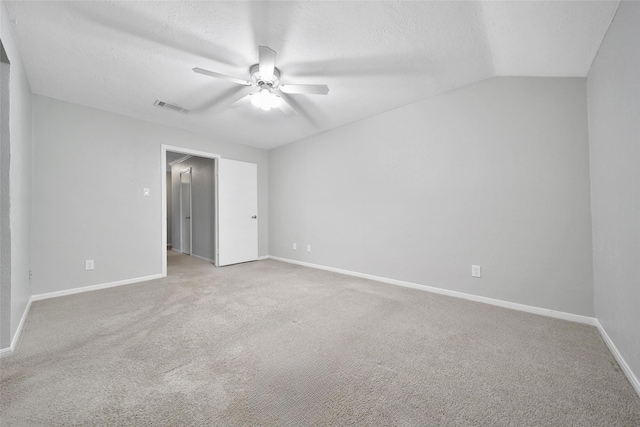 24193 Kelly St, Porter, TX 77365 - unfurnished bedroom featuring carpet flooring, vaulted ceiling, a ceiling fan, and a textured ceiling