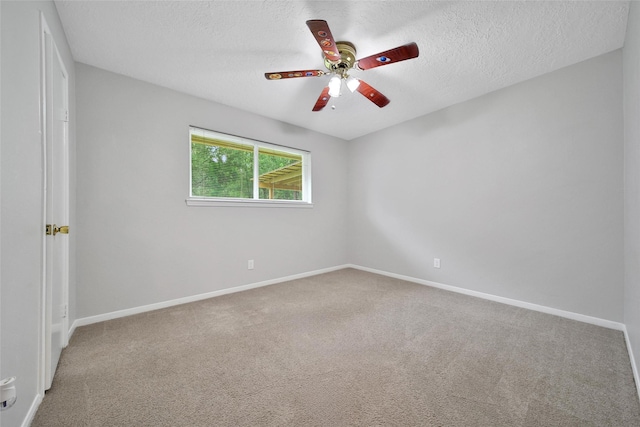 24193 Kelly St, Porter, TX 77365 - spare room featuring carpet flooring, a ceiling fan, and a textured ceiling