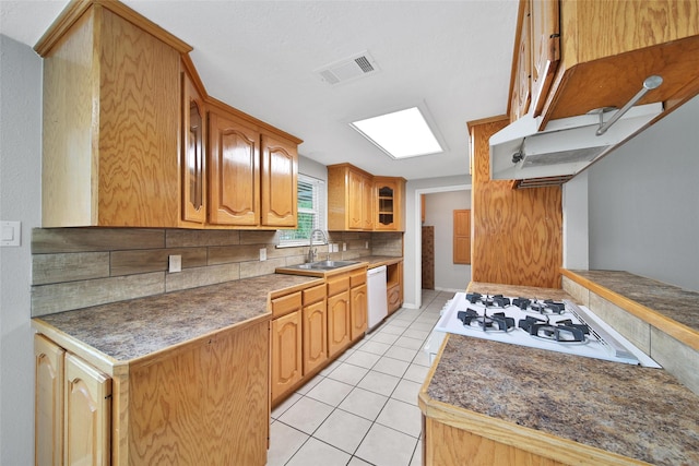 24193 Kelly St, Porter, TX 77365 - kitchen featuring white appliances, glass insert cabinets, decorative backsplash, and light tile patterned floors