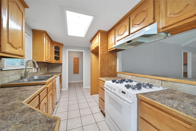 24193 Kelly St, Porter, TX 77365 - kitchen featuring white appliances, under cabinet range hood, backsplash, light tile patterned floors, and glass insert cabinets