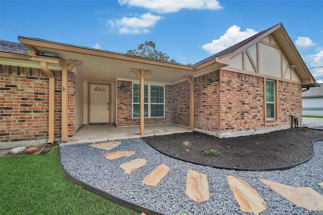 24193 Kelly St, Porter, TX 77365 - rear view of property featuring brick siding and a patio area