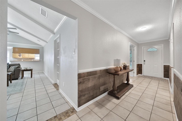 24193 Kelly St, Porter, TX 77365 - foyer with light tile patterned floors, crown molding, vaulted ceiling, a wainscoted wall, and a ceiling fan