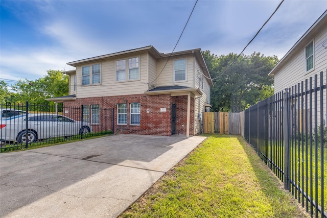 8130 Jutland Rd, Houston, TX 77033 - traditional-style home featuring brick siding, concrete driveway, and a fenced backyard