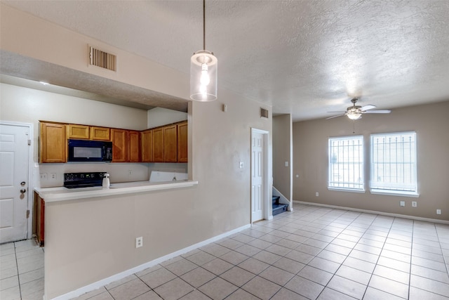 8130 Jutland Rd, Houston, TX 77033 - kitchen with black appliances, a textured ceiling, light tile patterned floors, a ceiling fan, and brown cabinets