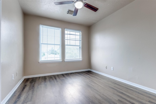 8130 Jutland Rd, Houston, TX 77033 - spare room with wood finished floors, ceiling fan, and a textured ceiling