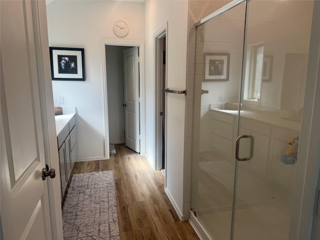 2944 Cordova Hill Dr, Katy, TX 77493 - bathroom featuring wood finished floors, vanity, and a shower stall