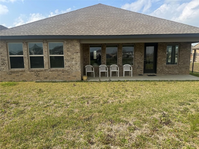 2944 Cordova Hill Dr, Katy, TX 77493 - back of house featuring a shingled roof, a patio, and brick siding