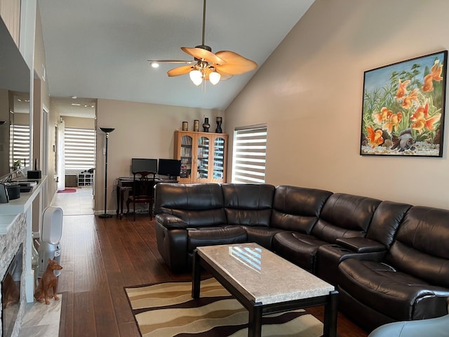 12117 Bob White Dr, Houston, TX 77035 - living area with ceiling fan, healthy amount of natural light, hardwood / wood-style floors, high vaulted ceiling, and a glass covered fireplace