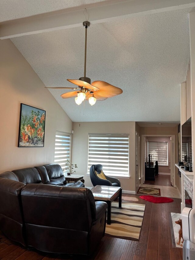 12117 Bob White Dr, Houston, TX 77035 - living room with lofted ceiling, wood-type flooring, ceiling fan, and a textured ceiling