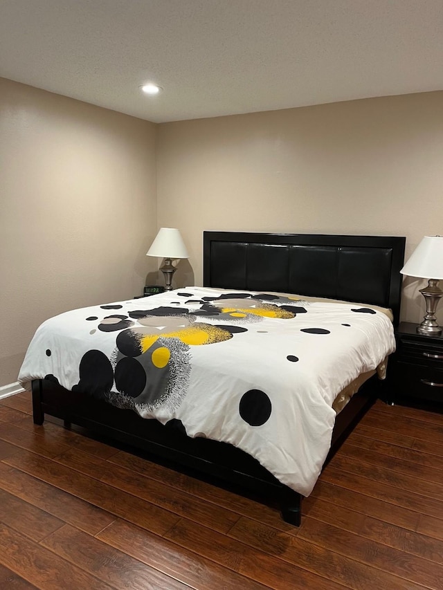 12117 Bob White Dr, Houston, TX 77035 - bedroom featuring dark wood finished floors and recessed lighting