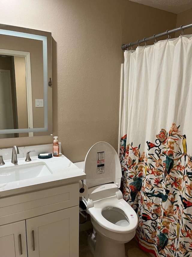 12117 Bob White Dr, Houston, TX 77035 - full bath with vanity, a textured wall, and curtained shower