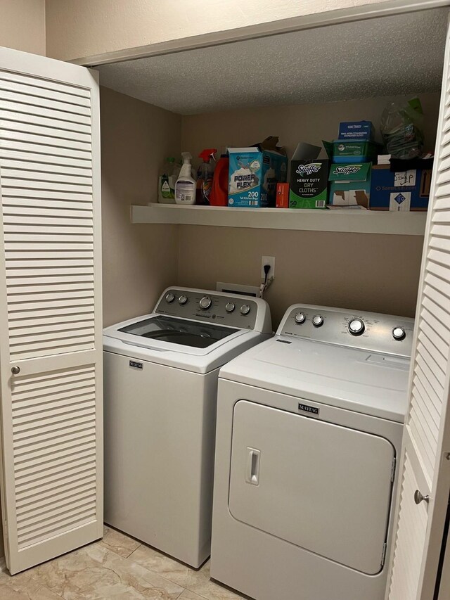 12117 Bob White Dr, Houston, TX 77035 - washroom with washing machine and clothes dryer