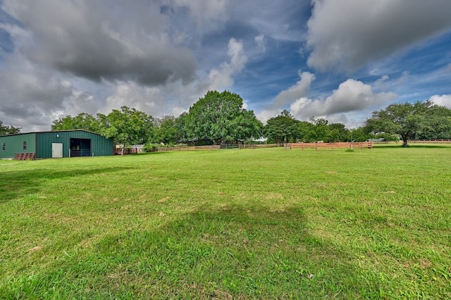 5425 Sandy Creek Ln, Brenham, TX 77833 - view of green lawn featuring an outbuilding, a detached garage, and an outdoor structure