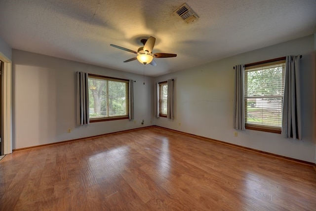 5425 Sandy Creek Ln, Brenham, TX 77833 - empty room featuring light wood-style flooring, ceiling fan, and a textured ceiling