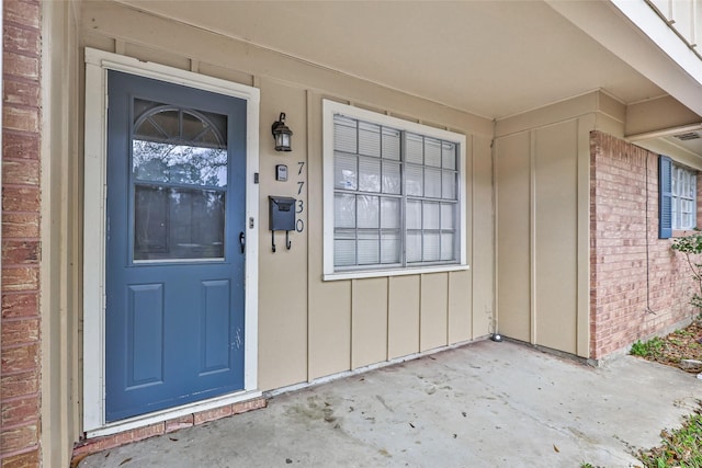 7730 Wickersham Pl, Beaumont, TX 77706 - property entrance with board and batten siding and brick siding