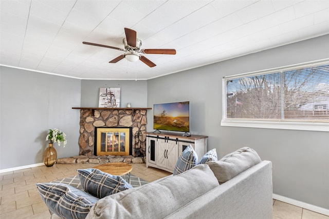 7730 Wickersham Pl, Beaumont, TX 77706 - living room with ceiling fan, tile patterned floors, and a stone fireplace