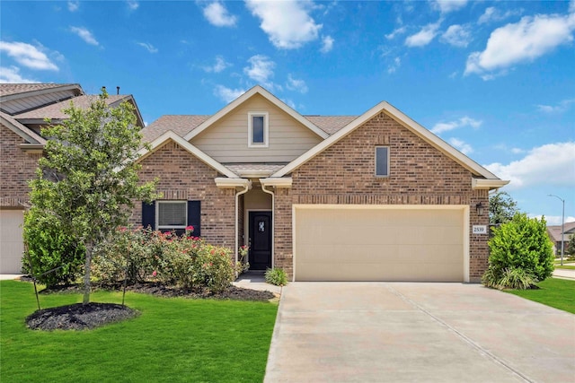 2539 Blazing Star Dr, Brookshire, TX 77423 - view of front of property featuring brick siding, driveway, a front yard, a shingled roof, and a garage