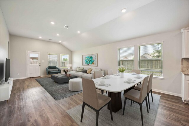 2539 Blazing Star Dr, Brookshire, TX 77423 - dining room with dark wood-type flooring, vaulted ceiling, and recessed lighting