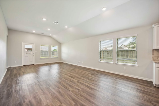 2539 Blazing Star Dr, Brookshire, TX 77423 - unfurnished living room featuring dark wood finished floors, vaulted ceiling, and recessed lighting
