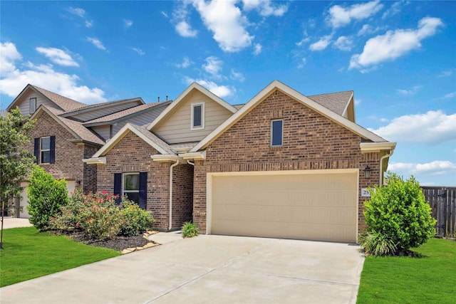 2539 Blazing Star Dr, Brookshire, TX 77423 - view of front facade with brick siding, driveway, roof with shingles, and an attached garage