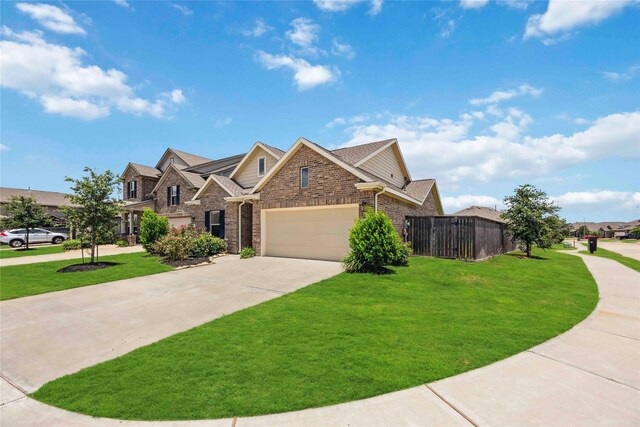 2539 Blazing Star Dr, Brookshire, TX 77423 - view of front of house with brick siding, a garage, and driveway