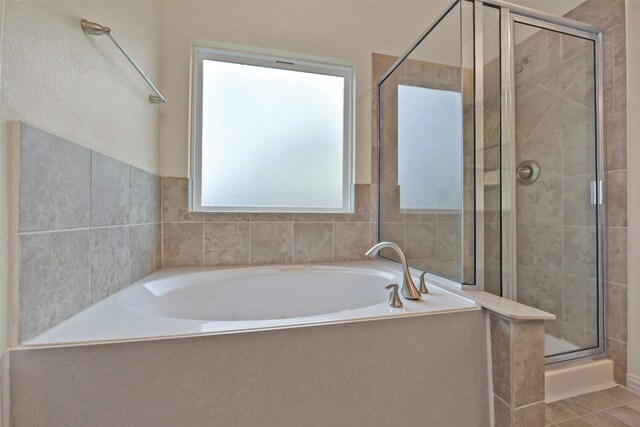 19823 White Pearl Ct, Houston, TX 77073 - bathroom featuring a shower stall and a bath