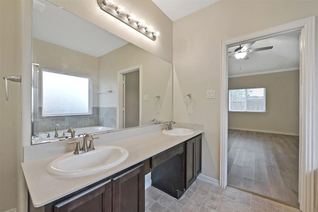 19823 White Pearl Ct, Houston, TX 77073 - bathroom featuring double vanity, a garden tub, a ceiling fan, and ornamental molding