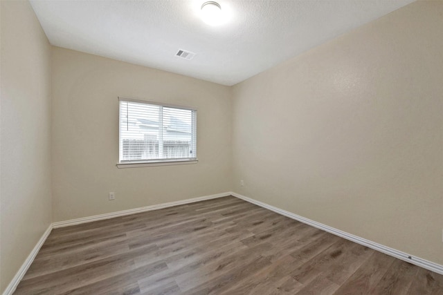 19823 White Pearl Ct, Houston, TX 77073 - empty room with wood finished floors and baseboards