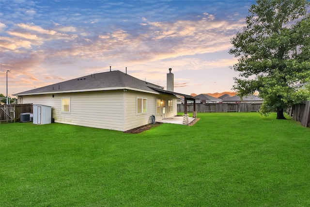 19823 White Pearl Ct, Houston, TX 77073 - rear view of property featuring a fenced backyard, a patio area, and a chimney