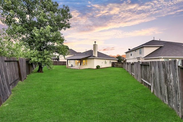 19823 White Pearl Ct, Houston, TX 77073 - yard at dusk with a fenced backyard