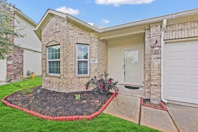 19823 White Pearl Ct, Houston, TX 77073 - doorway to property with a garage and brick siding